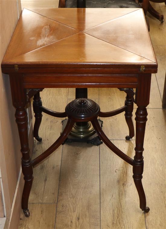 An Edwardian mahogany envelope card table W.54cm